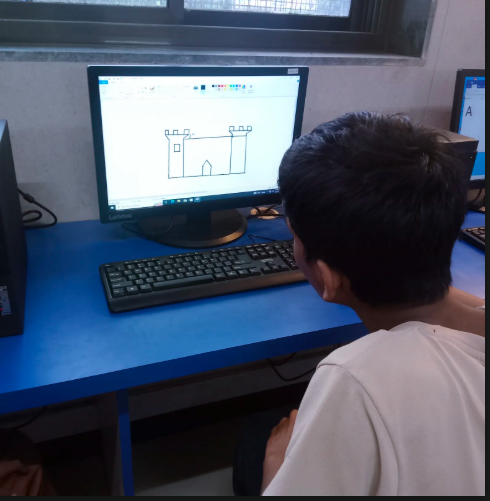 Student drawing on computer in digital literacy class